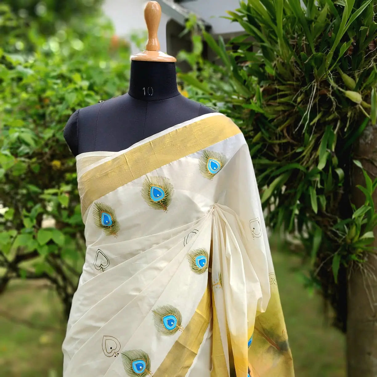 Hand-Painted Kerala Kasavu Saree Celebrating Baby Krishna