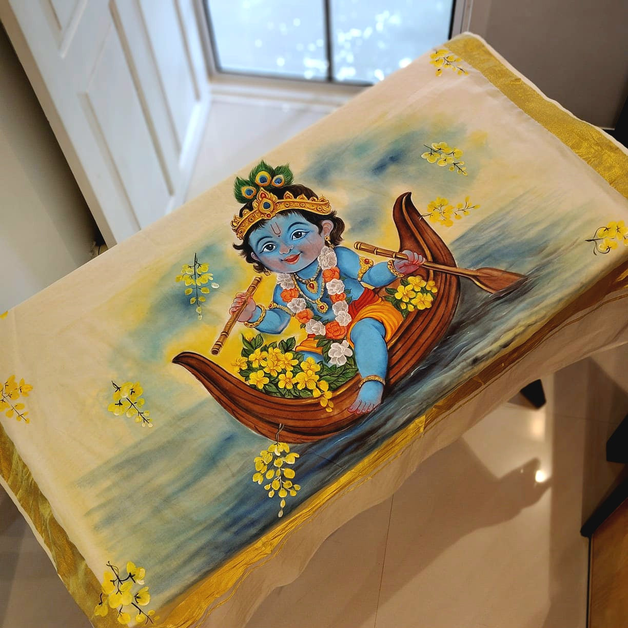 Traditional Kerala Kasavu Saree With A Beautifully Hand-Painted Baby Krishna Motif.