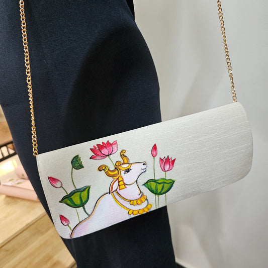 Hand-painted Clutch in PIchwai style.