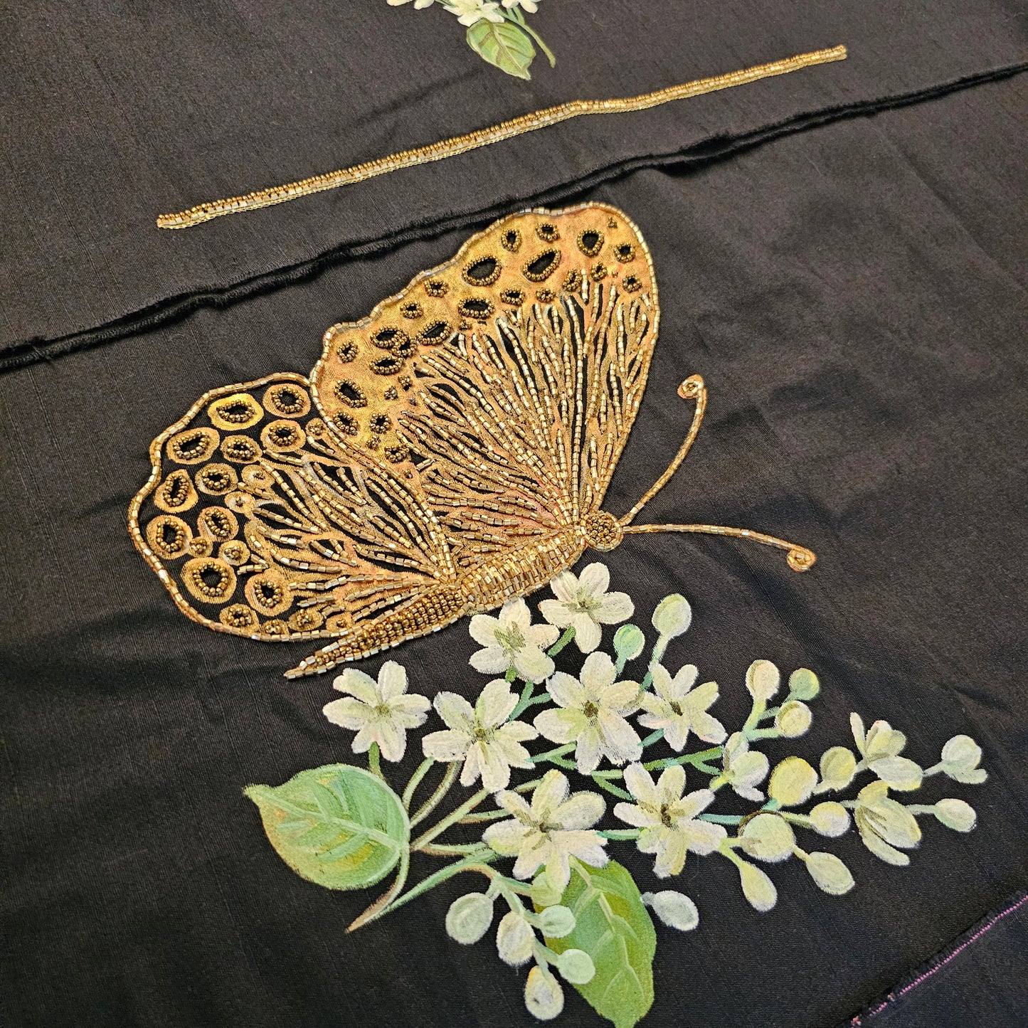 Stunning Black Organza Saree Adorned with Jasmine Flowers And Fluttering Butterflies