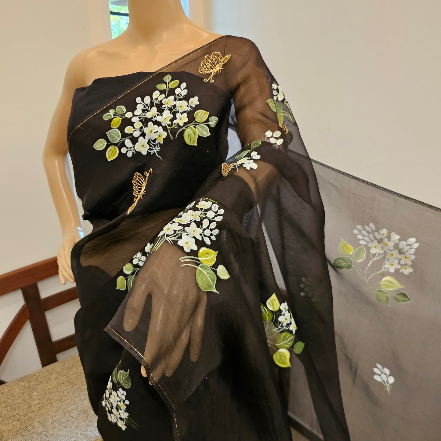 Stunning Black Organza Saree Adorned with Jasmine Flowers And Fluttering Butterflies