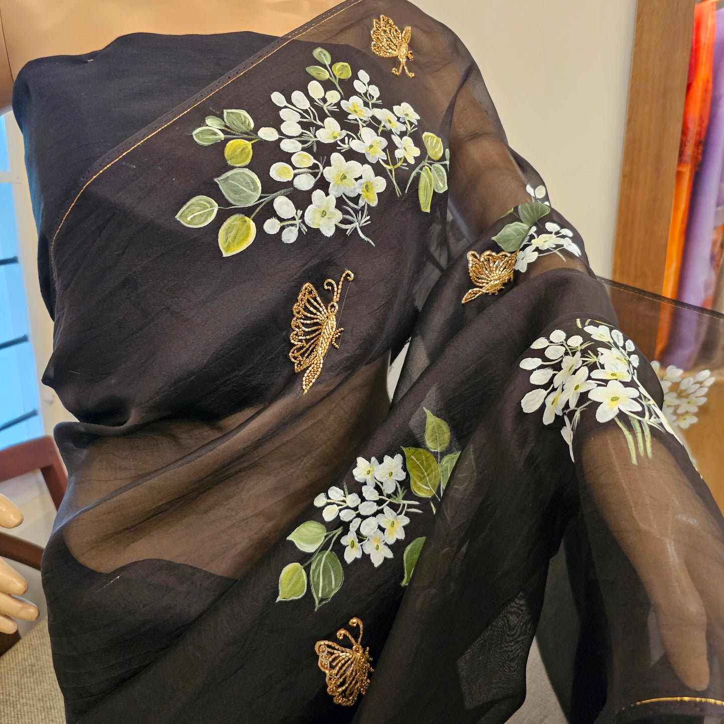 Stunning Black Organza Saree Adorned with Jasmine Flowers And Fluttering Butterflies