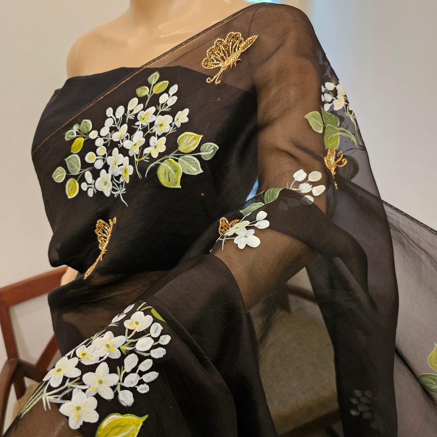 Stunning Black Organza Saree Adorned with Jasmine Flowers And Fluttering Butterflies