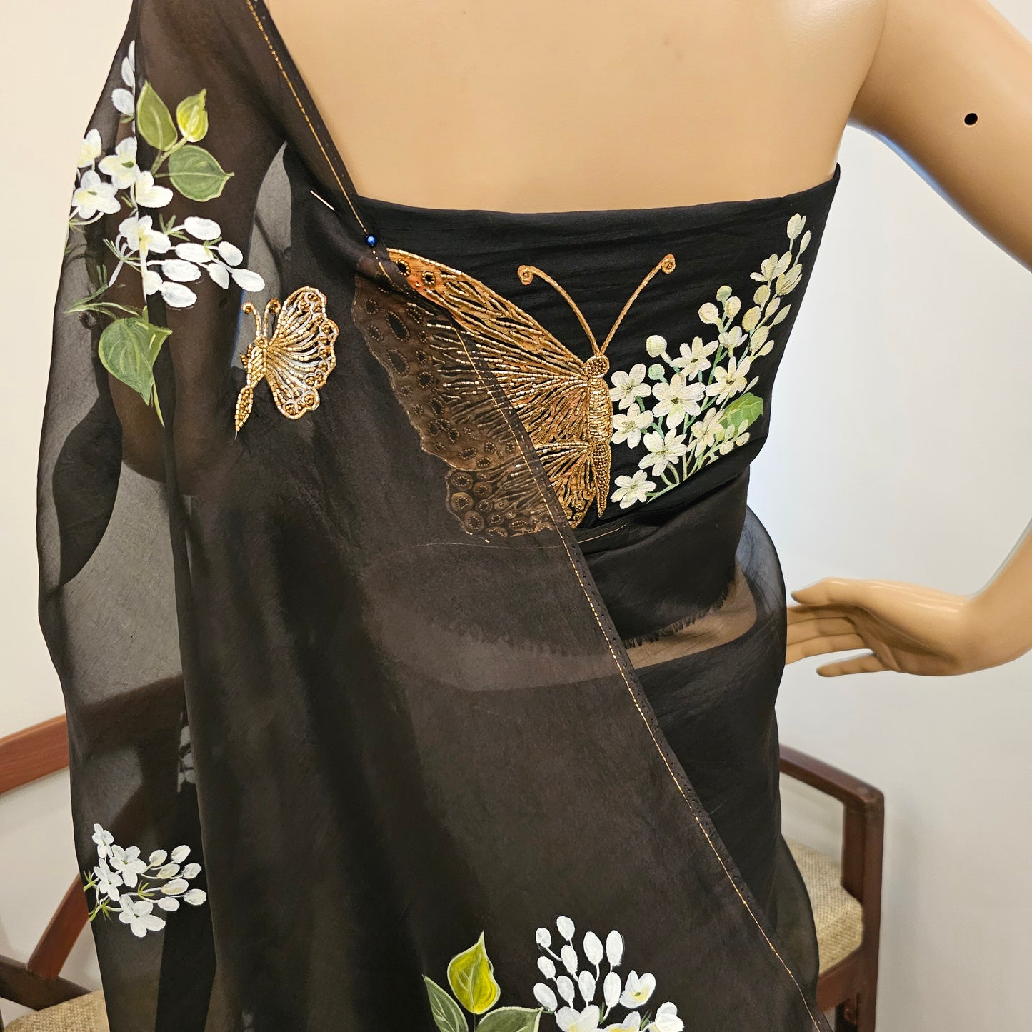 Stunning Black Organza Saree Adorned with Jasmine Flowers And Fluttering Butterflies