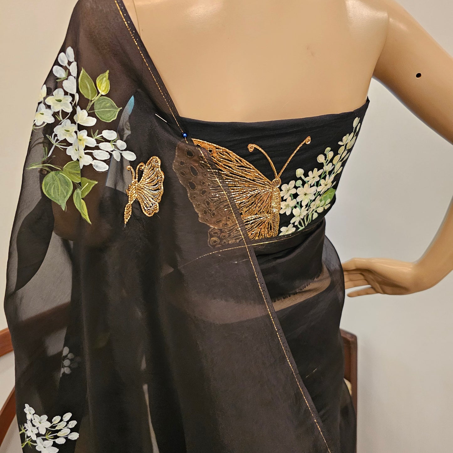 Stunning Black Organza Saree Adorned with Jasmine Flowers And Fluttering Butterflies