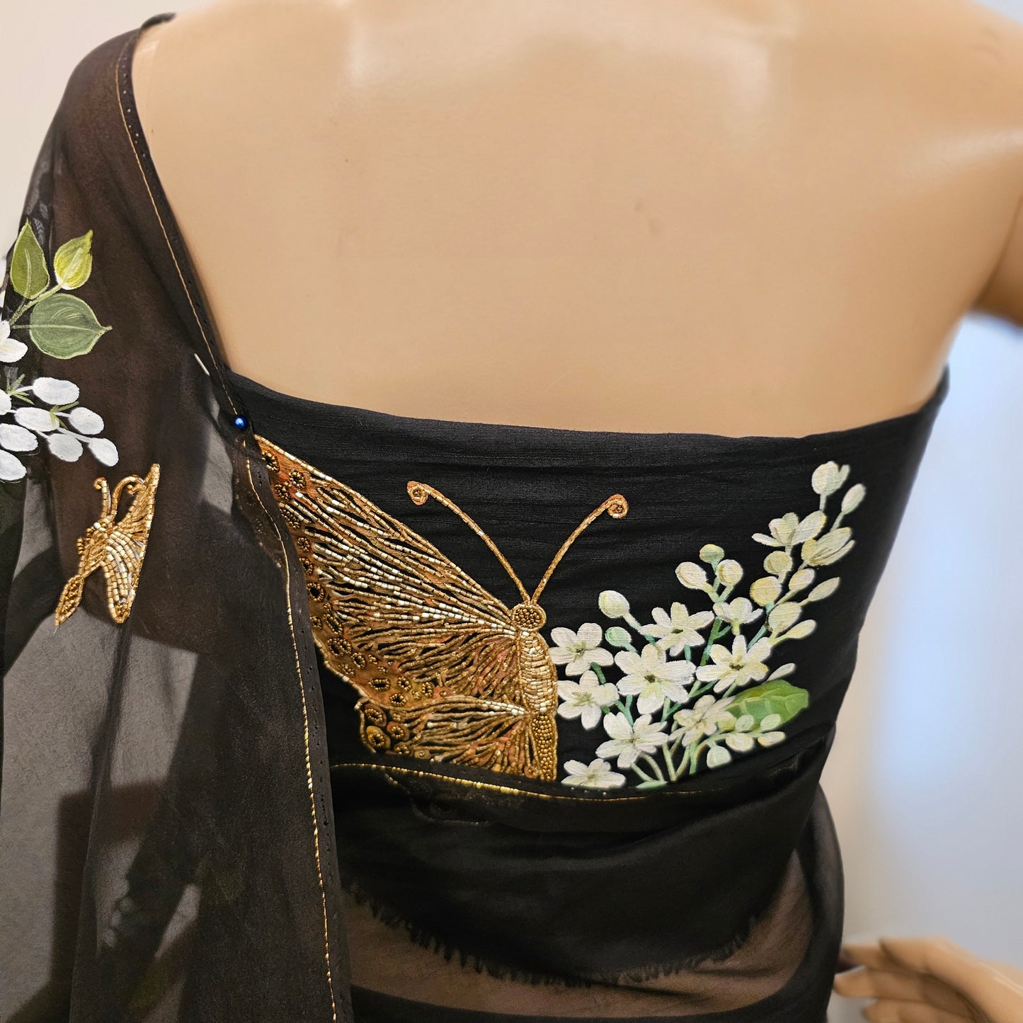 Stunning Black Organza Saree Adorned with Jasmine Flowers And Fluttering Butterflies