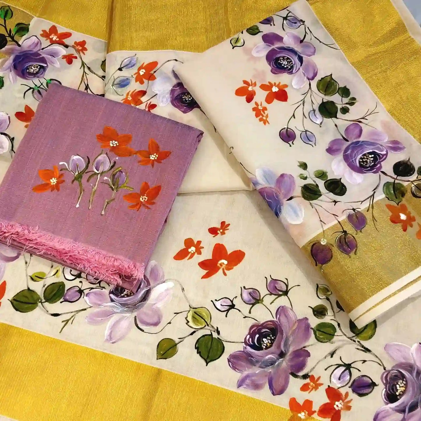 This Kasavu Set Mundu Blooms With The Charm Of Hand-Painted Wild Roses.