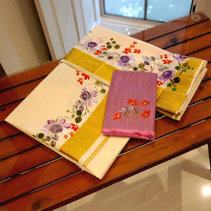 This Kasavu Set Mundu Blooms With The Charm Of Hand-Painted Wild Roses.