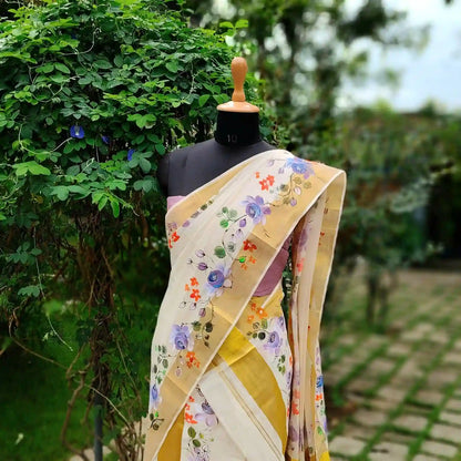 This Kasavu Set Mundu Blooms With The Charm Of Hand-Painted Wild Roses.