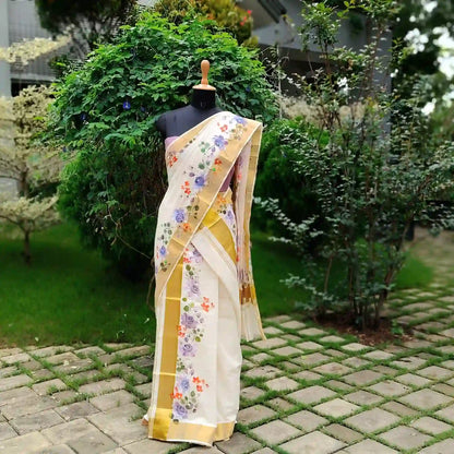 This Kasavu Set Mundu Blooms With The Charm Of Hand-Painted Wild Roses.