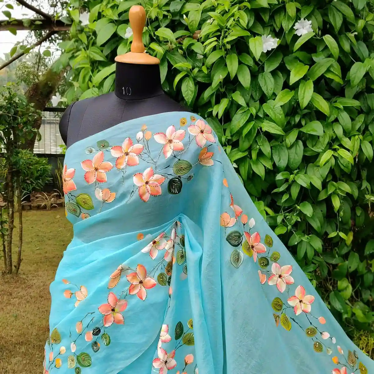 Dreamy Blue Silk Organza Saree With Plumeria Blossoms Painted For A Timeless Look