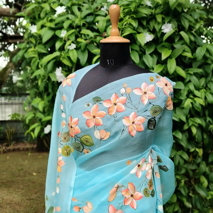 Dreamy Blue Silk Organza Saree With Plumeria Blossoms Painted For A Timeless Look