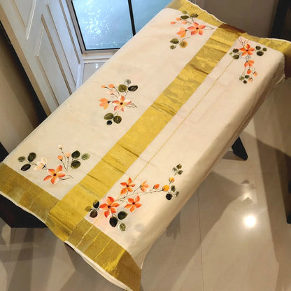 Graceful Kerala Saree With Hand-Painted Plumerias