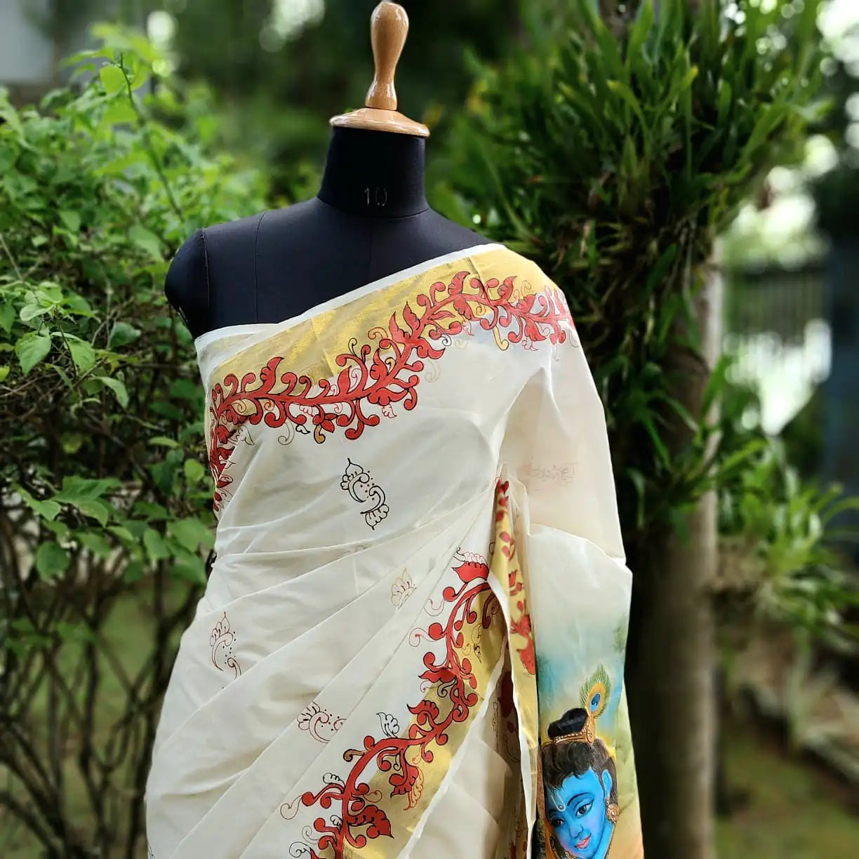 Graceful Kasavu drape with Baby Krishna Painting