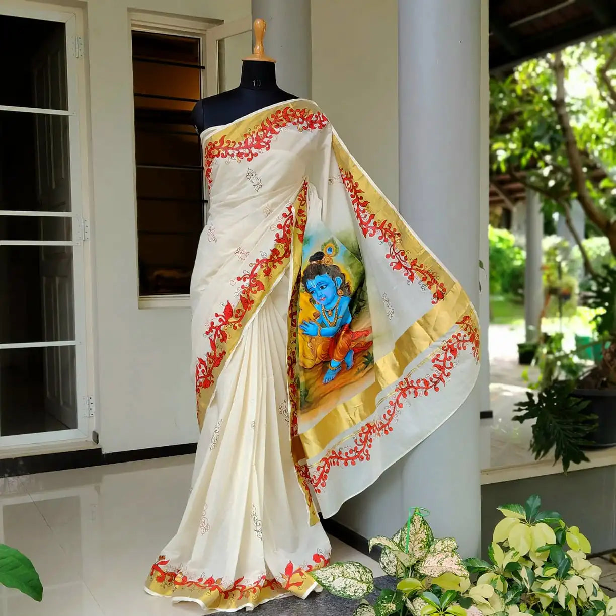 Graceful Kasavu drape with Baby Krishna Painting