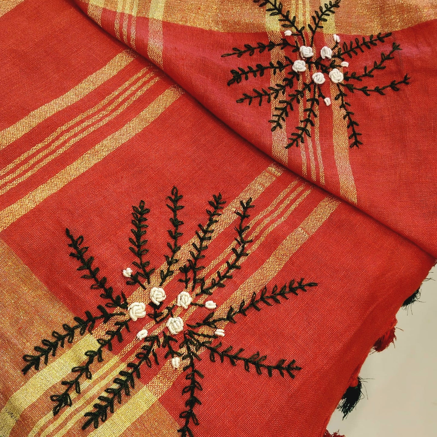 A linen Saree Graced With Hand-Embroidered Elegance