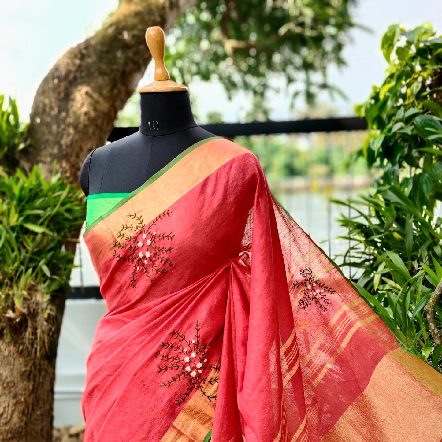 A linen Saree Graced With Hand-Embroidered Elegance