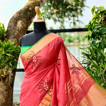 A linen Saree Graced With Hand-Embroidered Elegance