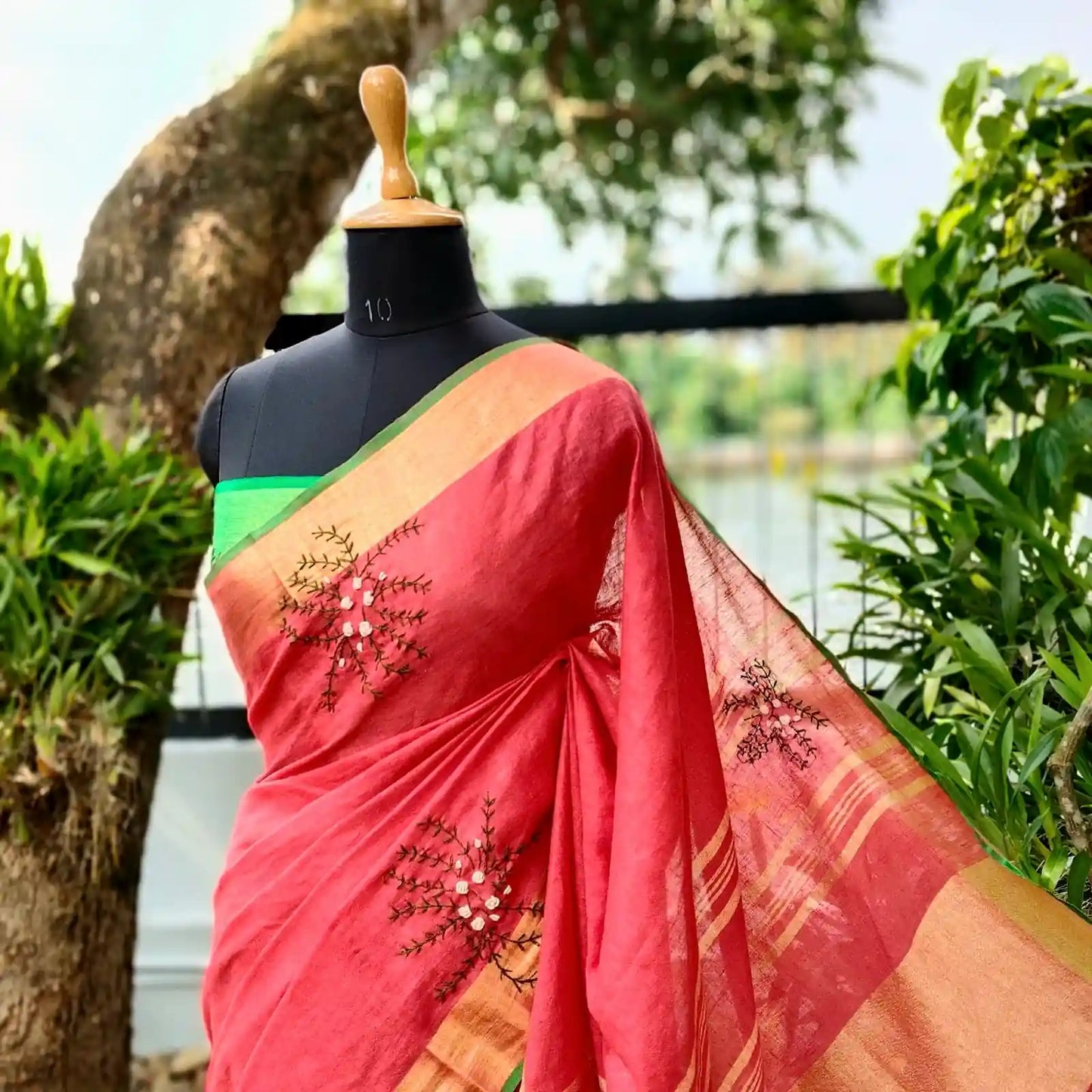 A linen Saree Graced With Hand-Embroidered Elegance