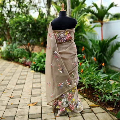 A Dreamy Pure Silk Organza Saree Adorned With Hand-Painted Wild Blooms