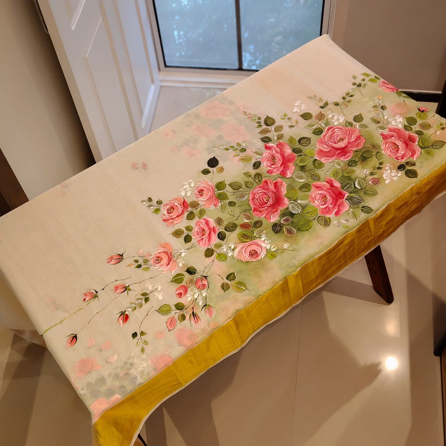 Elegant Kasavu Saree With Delicate Rose Art