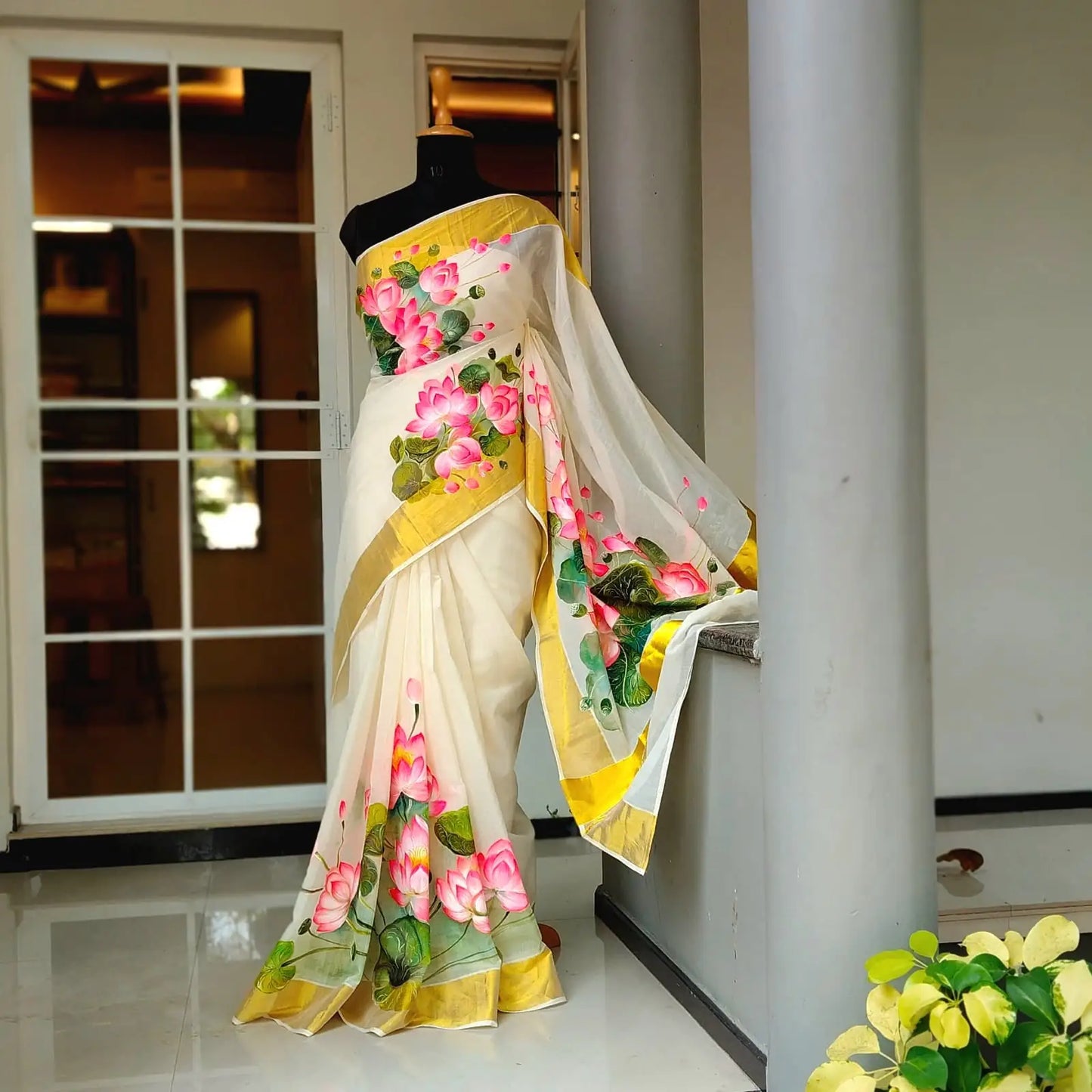 Where Tradition Meets Art – Hand-Painted Lotus On Handloom Kasavu Saree