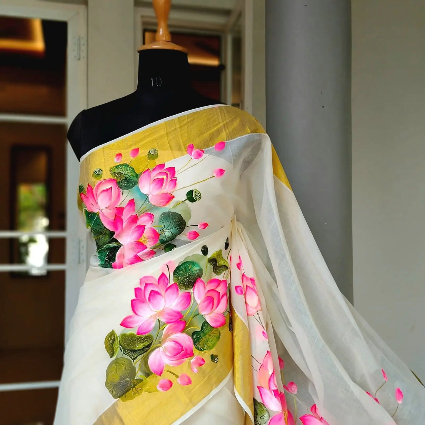 Where Tradition Meets Art – Hand-Painted Lotus On Handloom Kasavu Saree