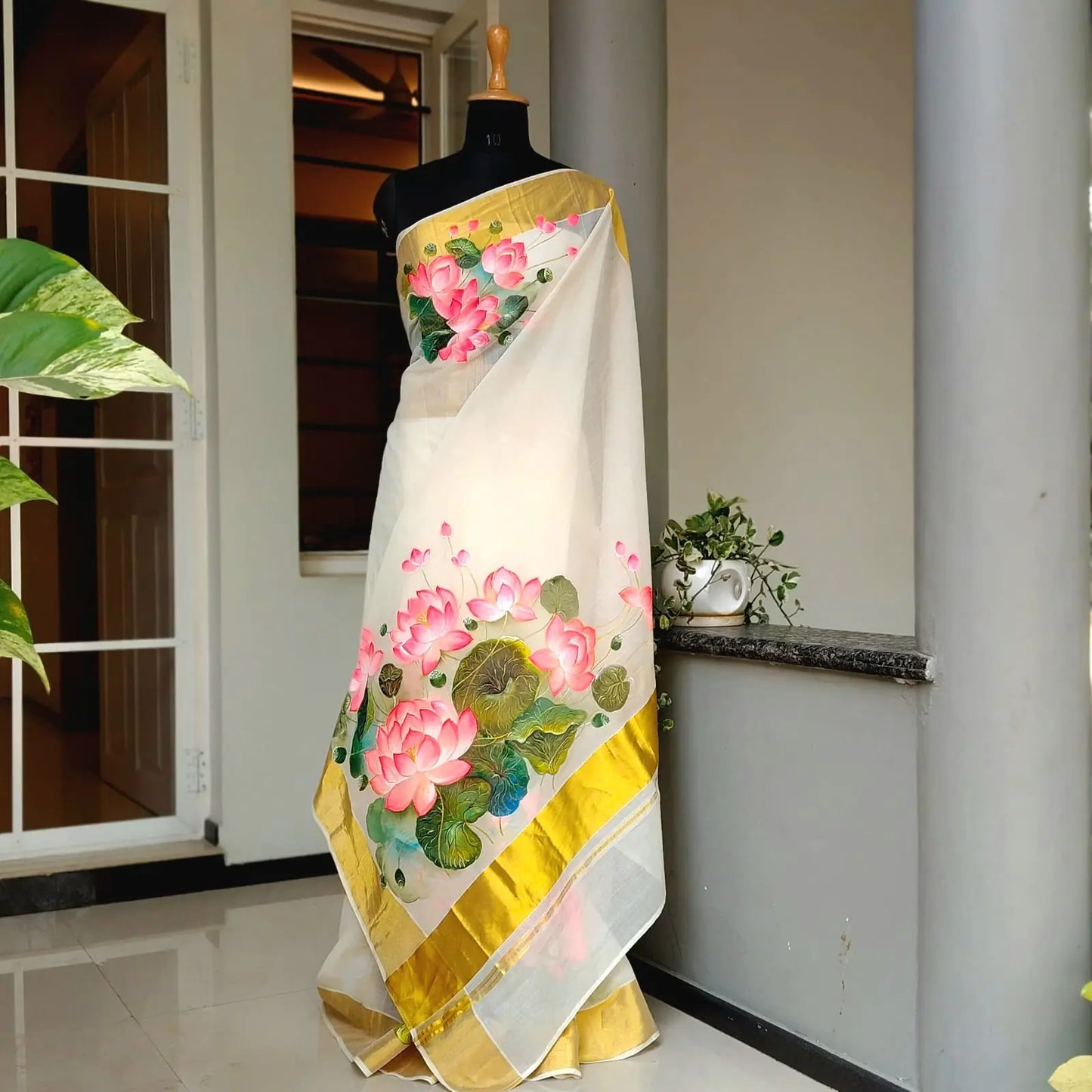Where Tradition Meets Art – Hand-Painted Lotus On Handloom Kasavu Saree