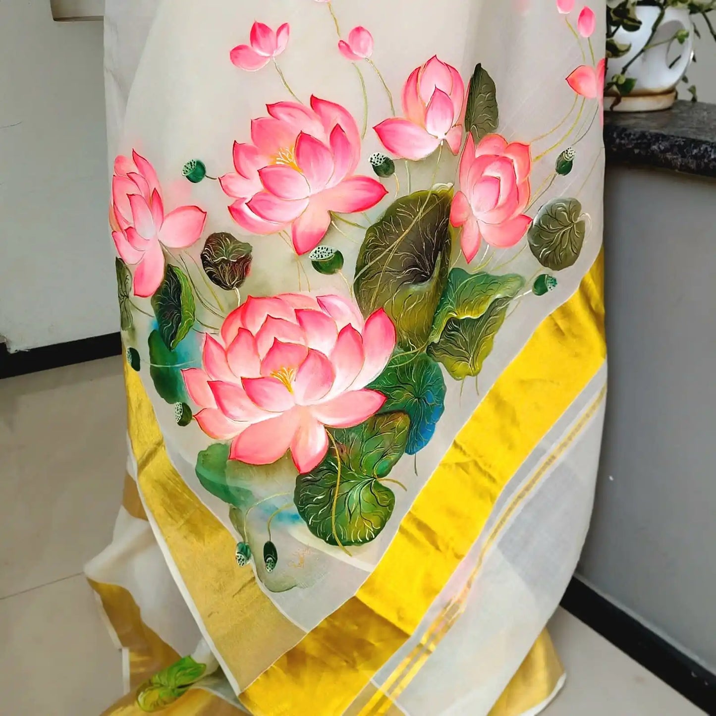 Where Tradition Meets Art – Hand-Painted Lotus On Handloom Kasavu Saree