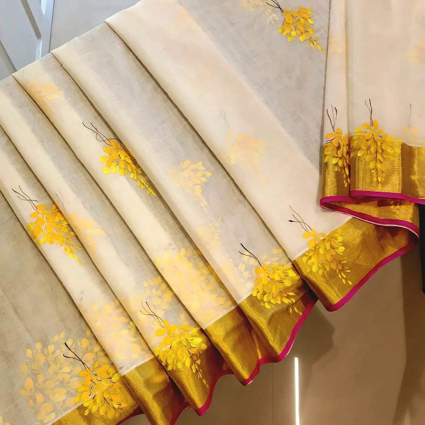 Graceful Kani Konna Florals on Kerala Kasavu -Subtle, Intricate, Timeless