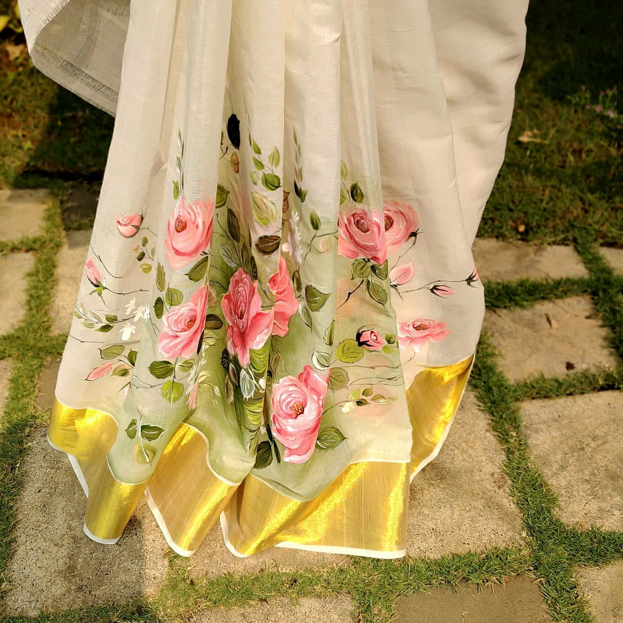 Elegant Kasavu Saree With Delicate Rose Art