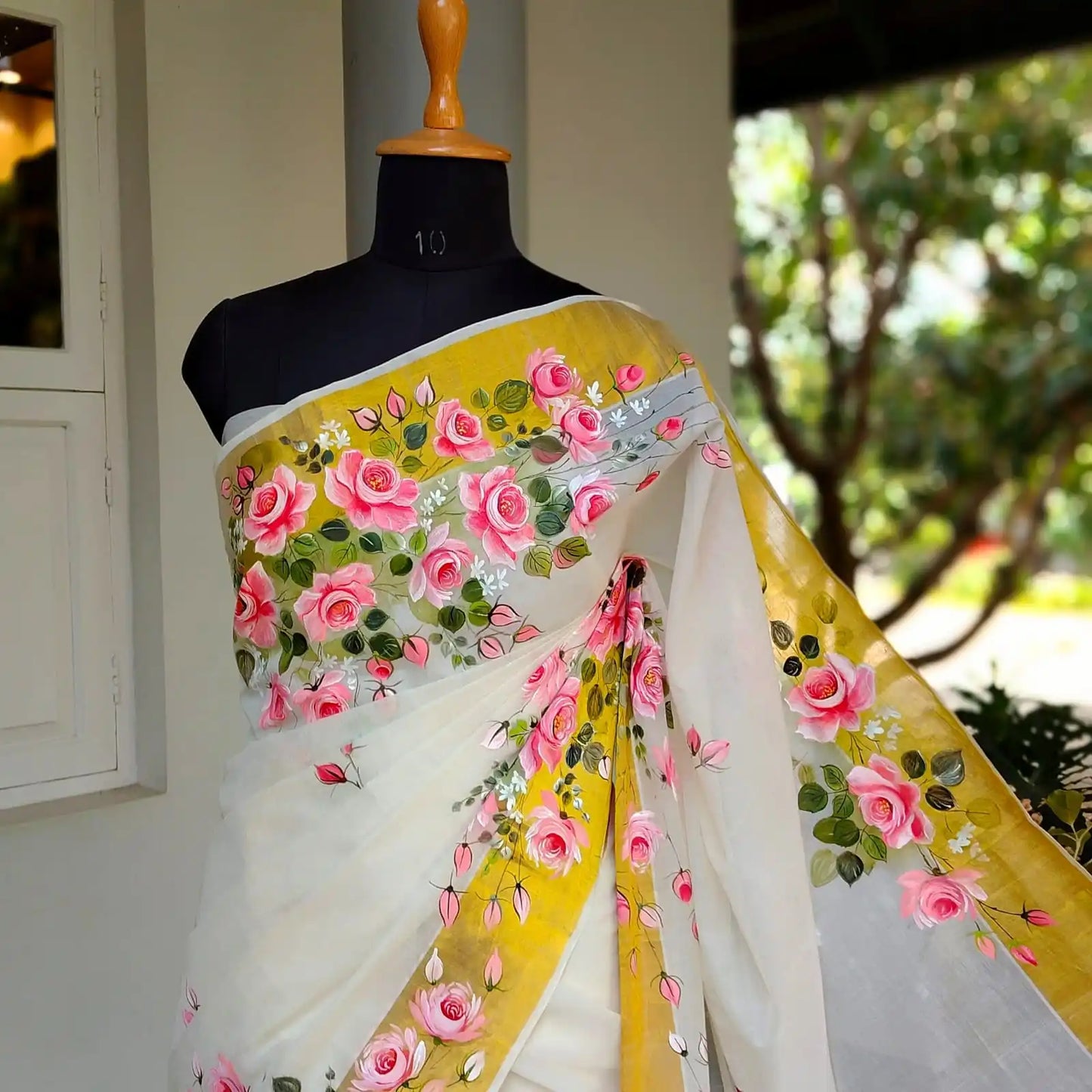 Elegant Kasavu Saree With Delicate Rose Art